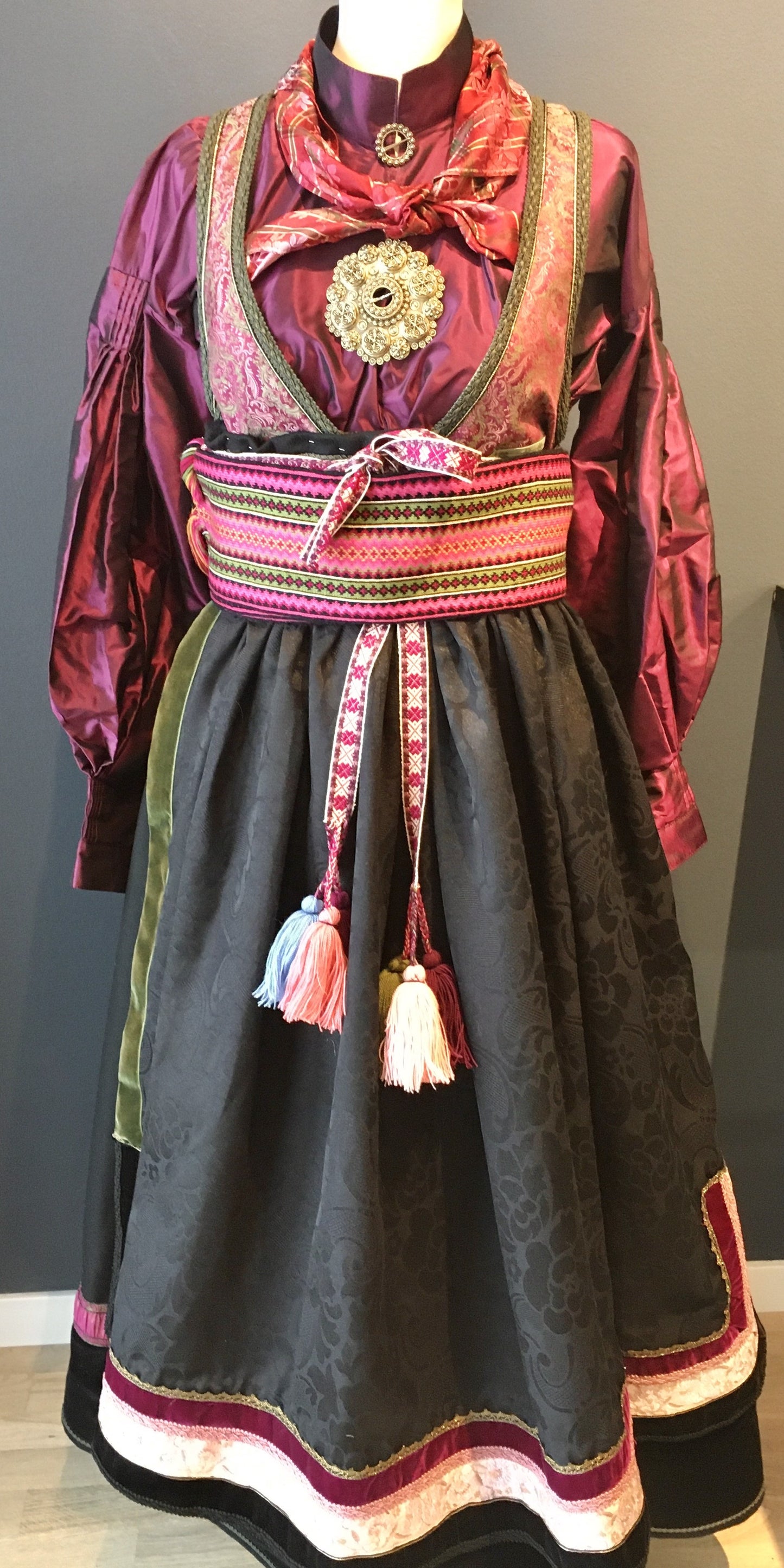 Beltestakk i rosa og lilla.