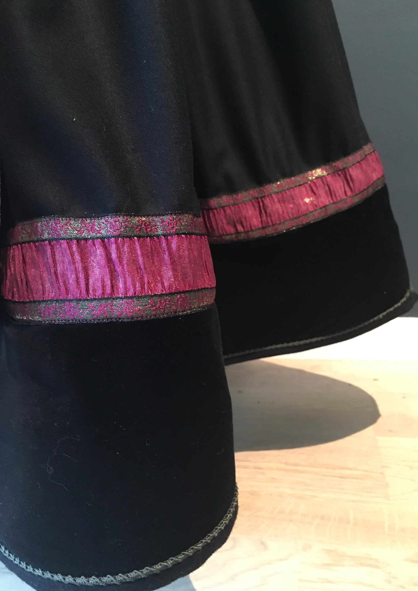 Beltestakk i rosa og lilla.